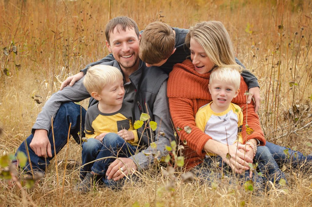 Family enjoying fall together at a pumpkin patch near Lake of the Ozarks, Missouri